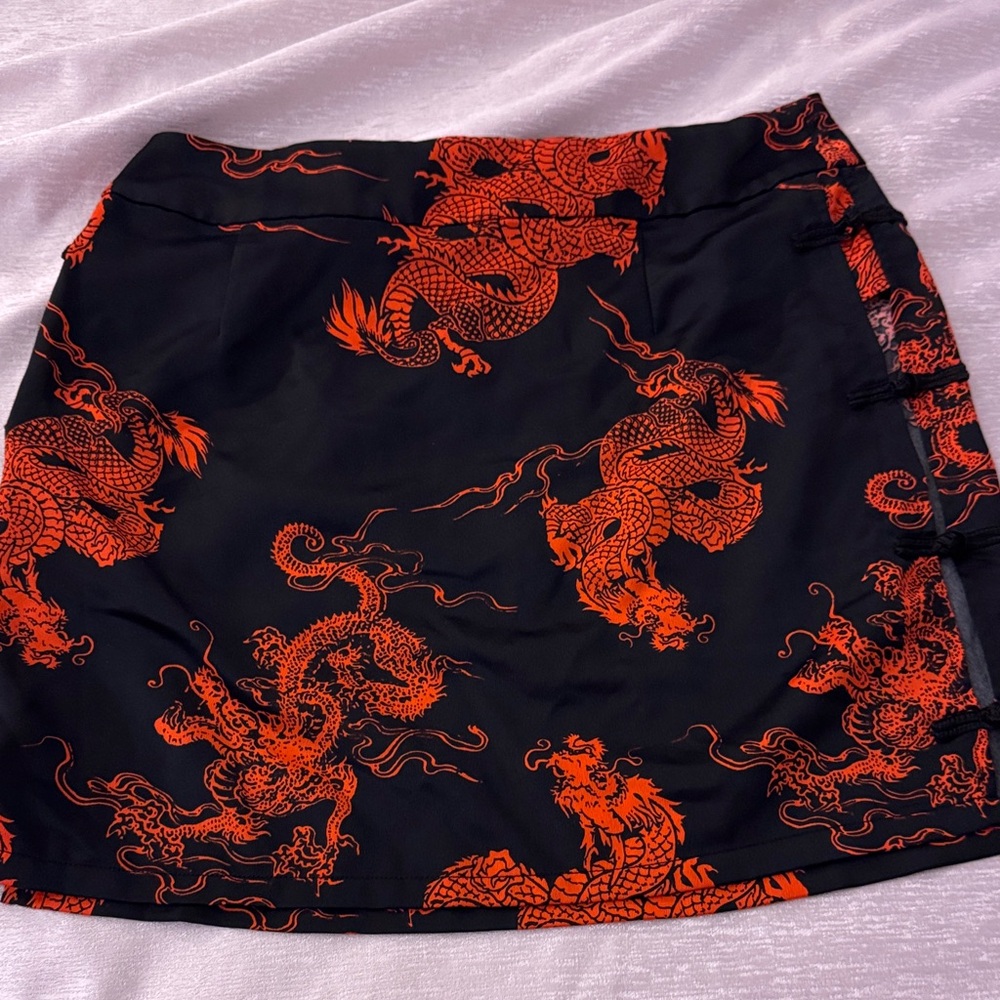 Elegant Black Skirt with Vibrant Orange Dragon Design